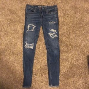 AEO medium wash skinny jeans with rips
